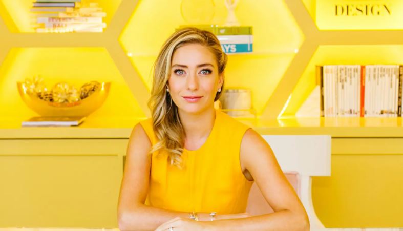influential women in tech whitney wolfe herd sitting at desk wearing yellow