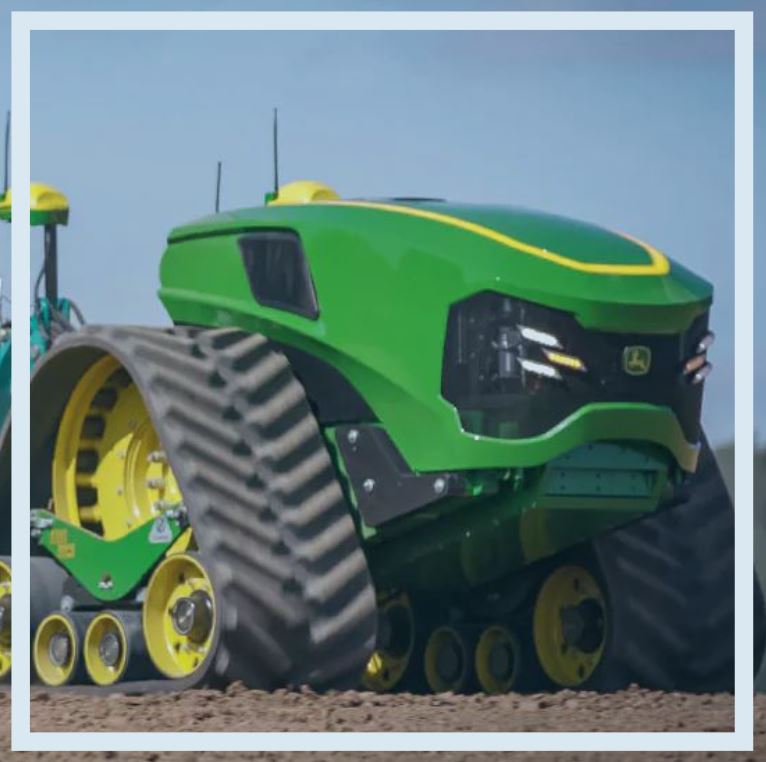 tech farming with john deere automated electric tractor in field 