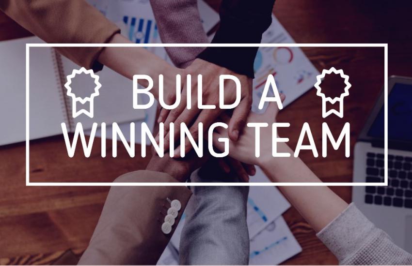 Build a Winning Team with hands clasped in background